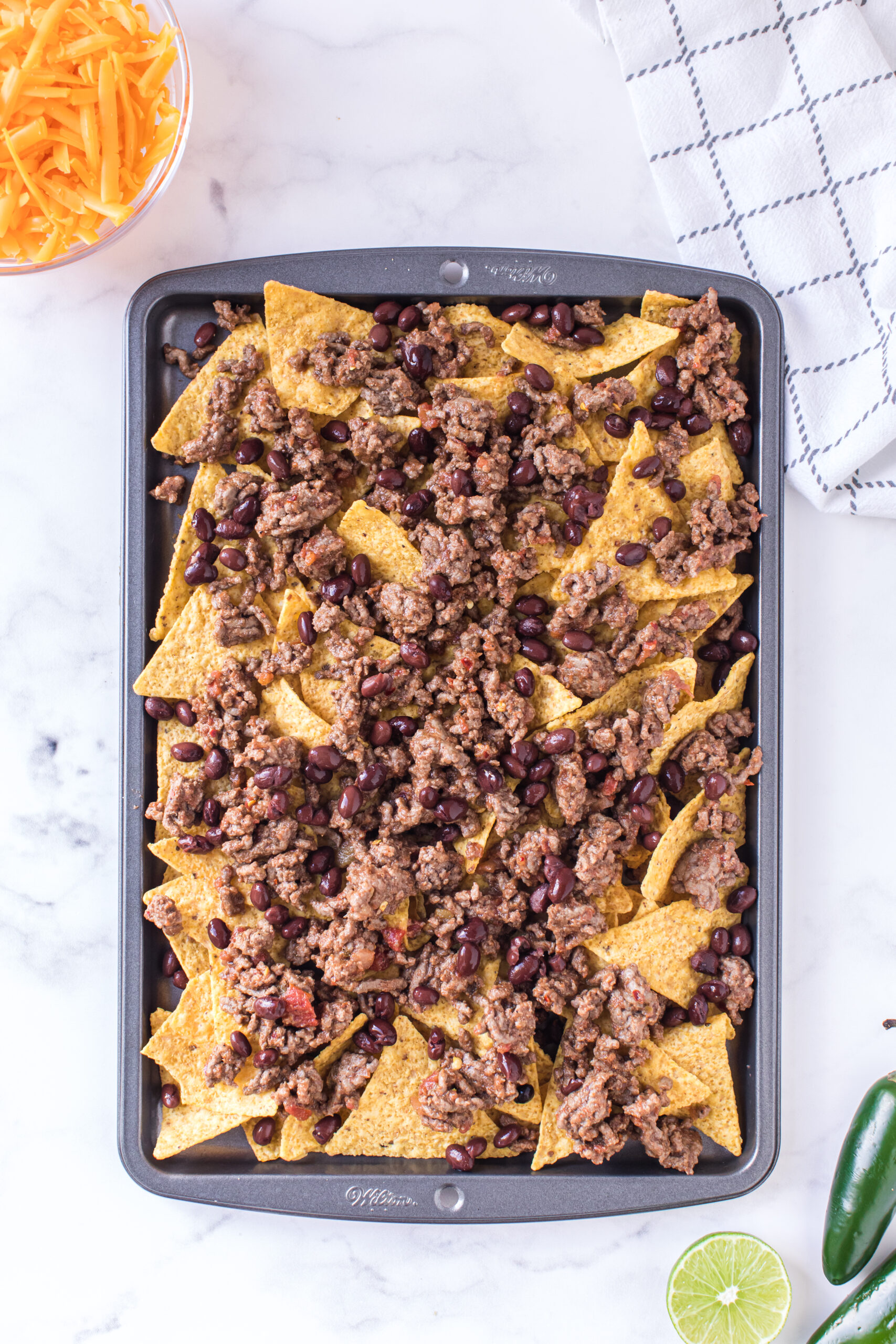 nachos with cooked seasoned beef