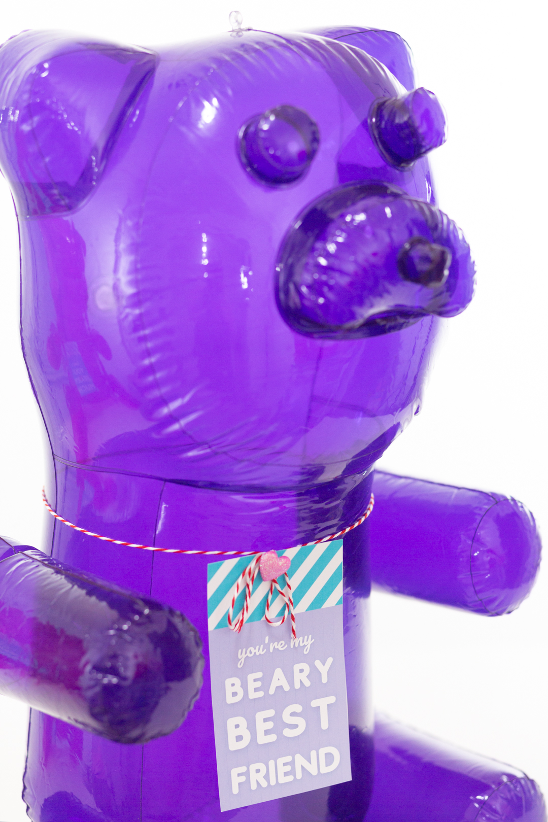 Big purple blow up gummy bear with valentine's day gift tag