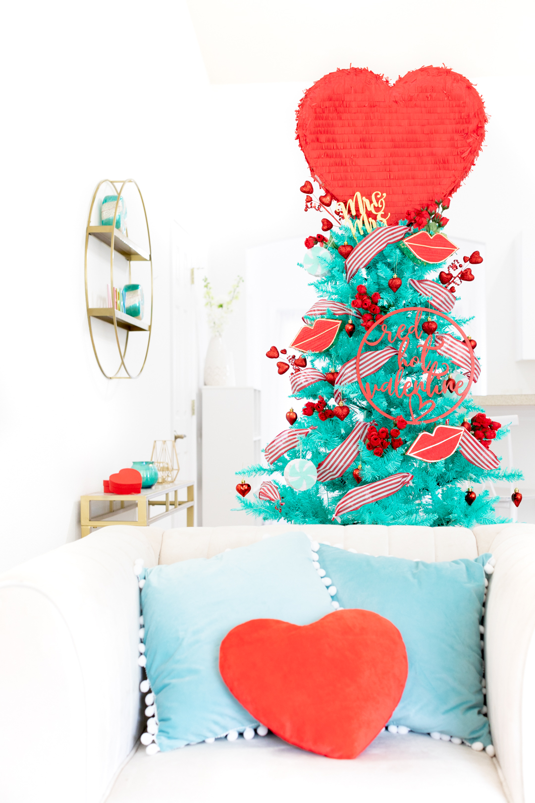 Romantic Valentine's day Christmas tree with big red heart pinata topper. Vintage tree. Cute for newlyweds.