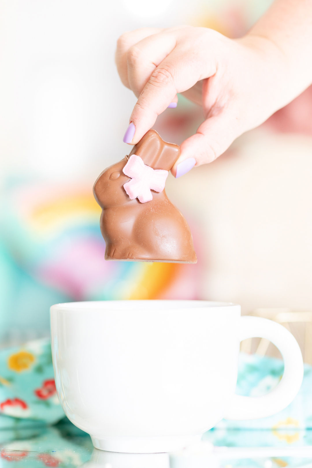 putting chocolate hot cocoa easter bunny into a giant mug