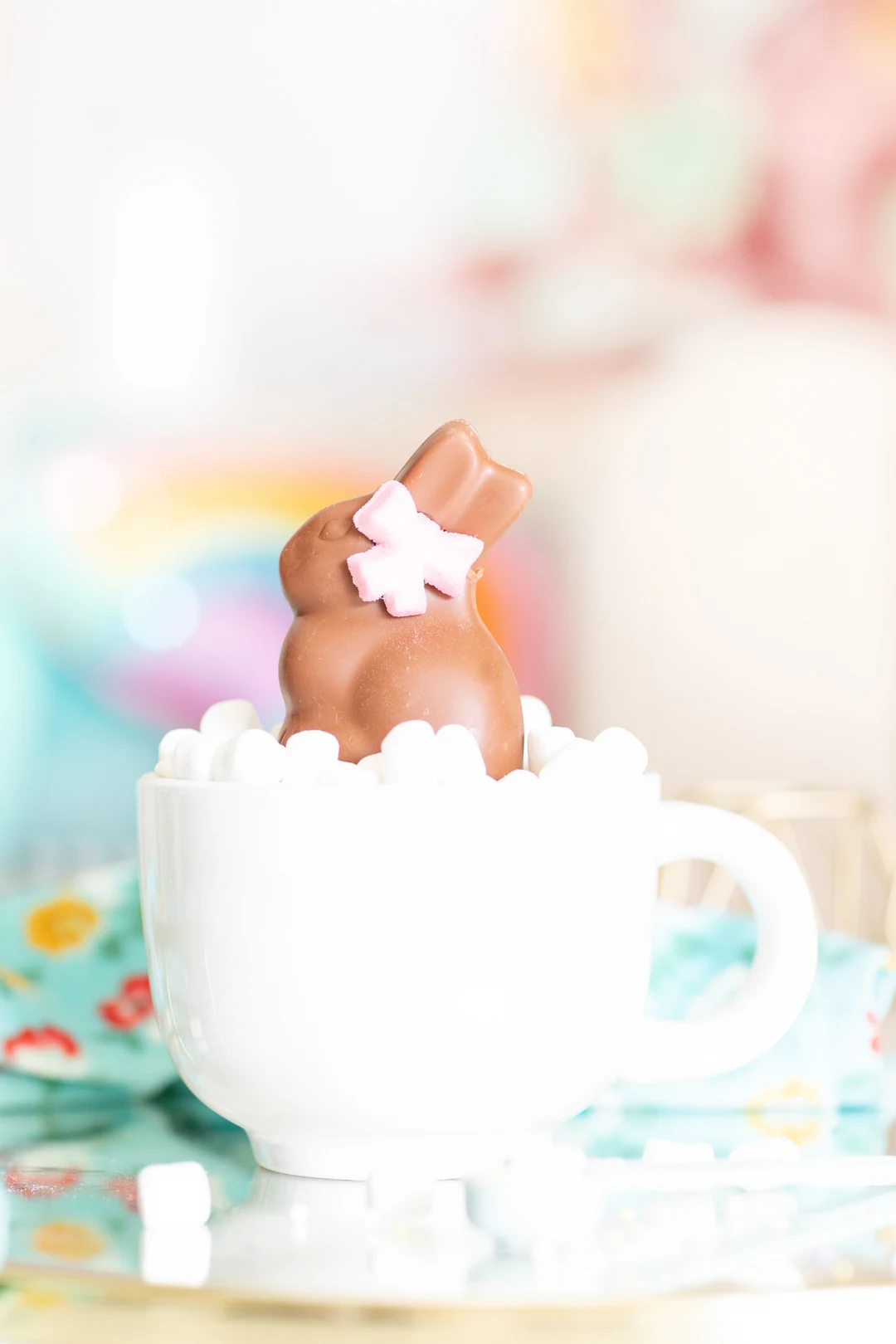 lindt gold bunny inside of a giant mug loaded with mini marshmallows