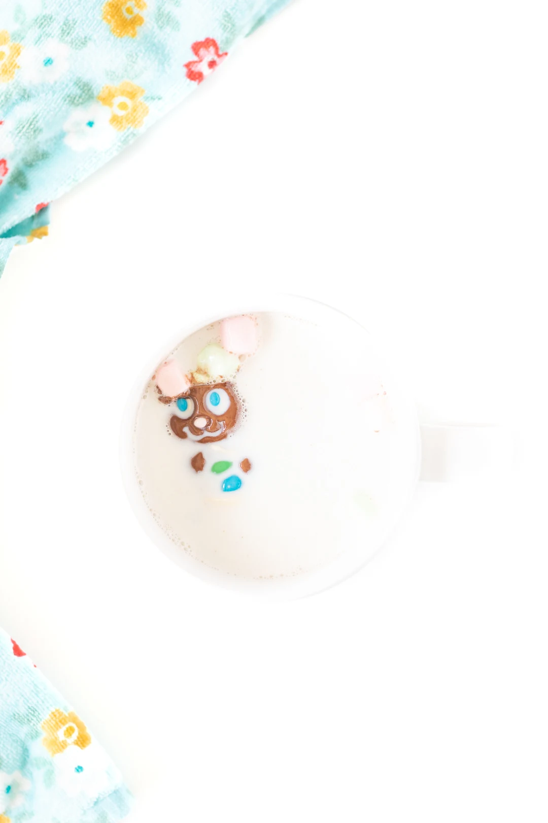 easter bunny cocoa melt being melted in a mug of hot milk as marshmallows pop out