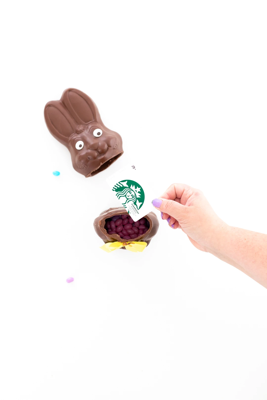 filling hollow chocolate easter bunny with gift cards and candy