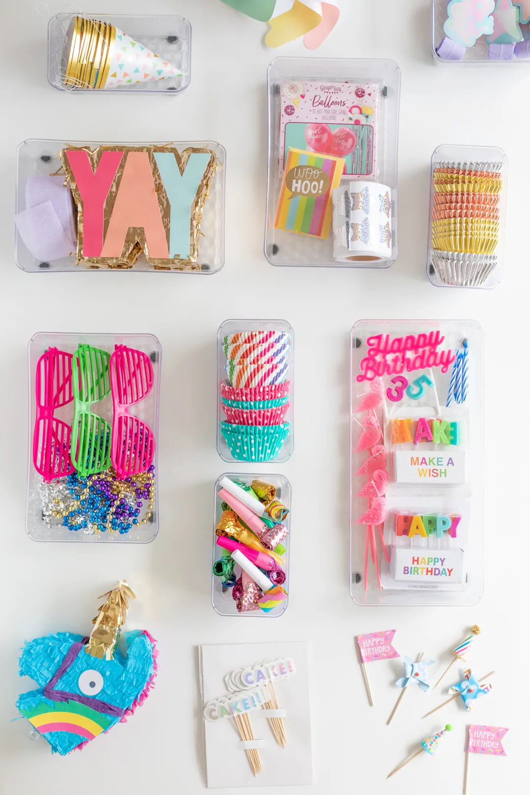 overhead photo of a variety of ways to organize party supplies and celebration supplies
