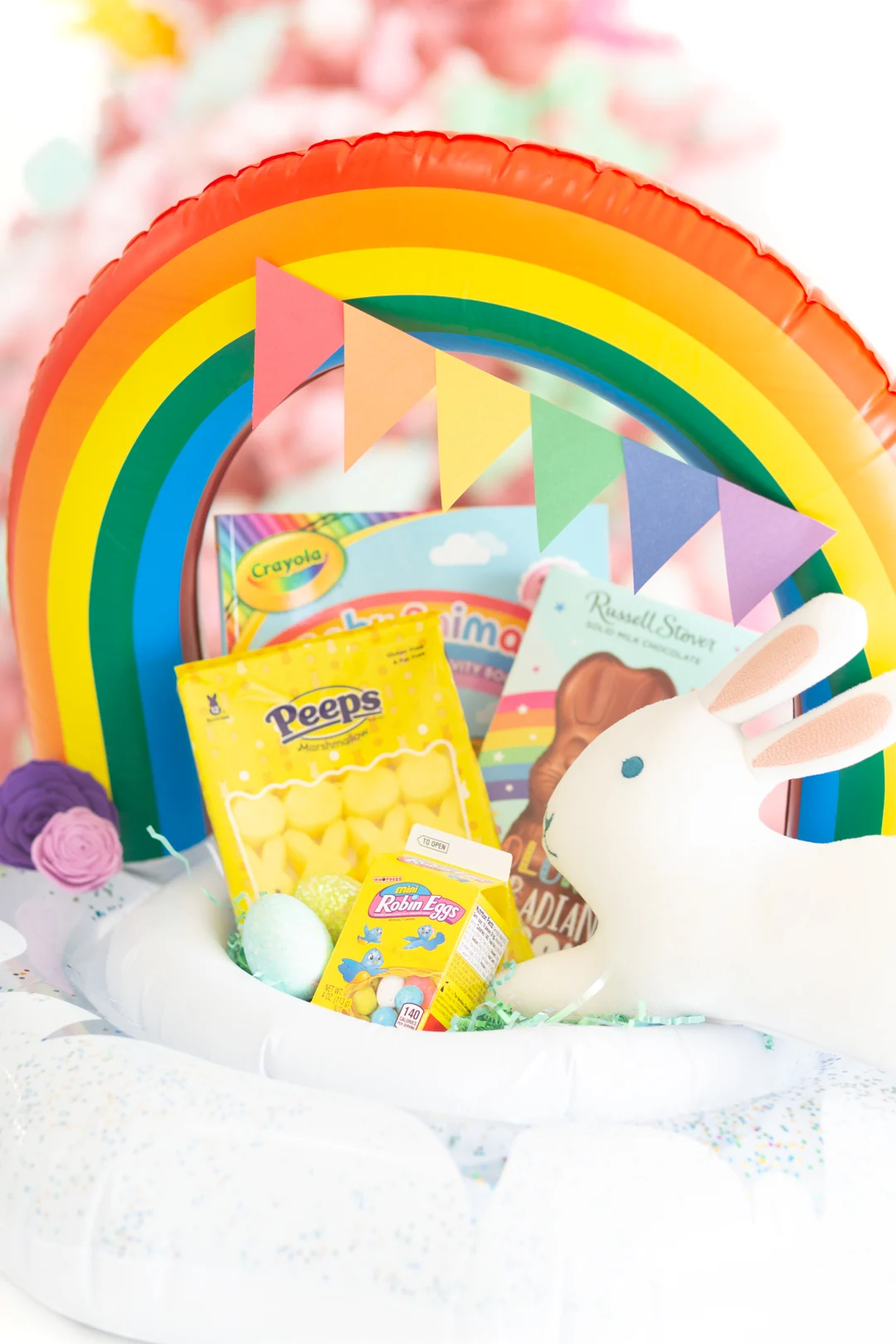 cute rainbow easter basket made out of an infant pool float.