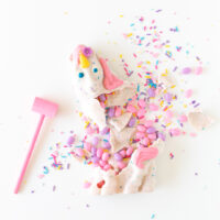 Smash unicorn with sprinkles and pastel jelly beans using a painted pink mini mallet