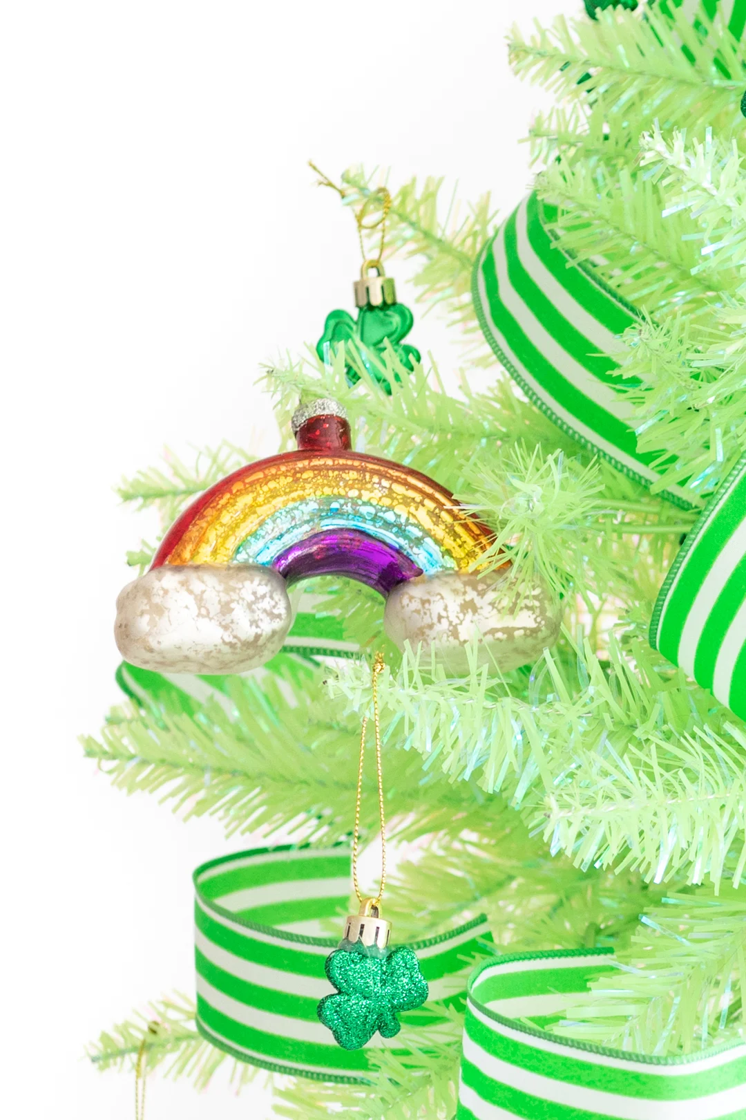 st. patrick's day ornaments. Glass rainbow ornament and green and white striped ribbon used to decorate for St. Patrick's Day.