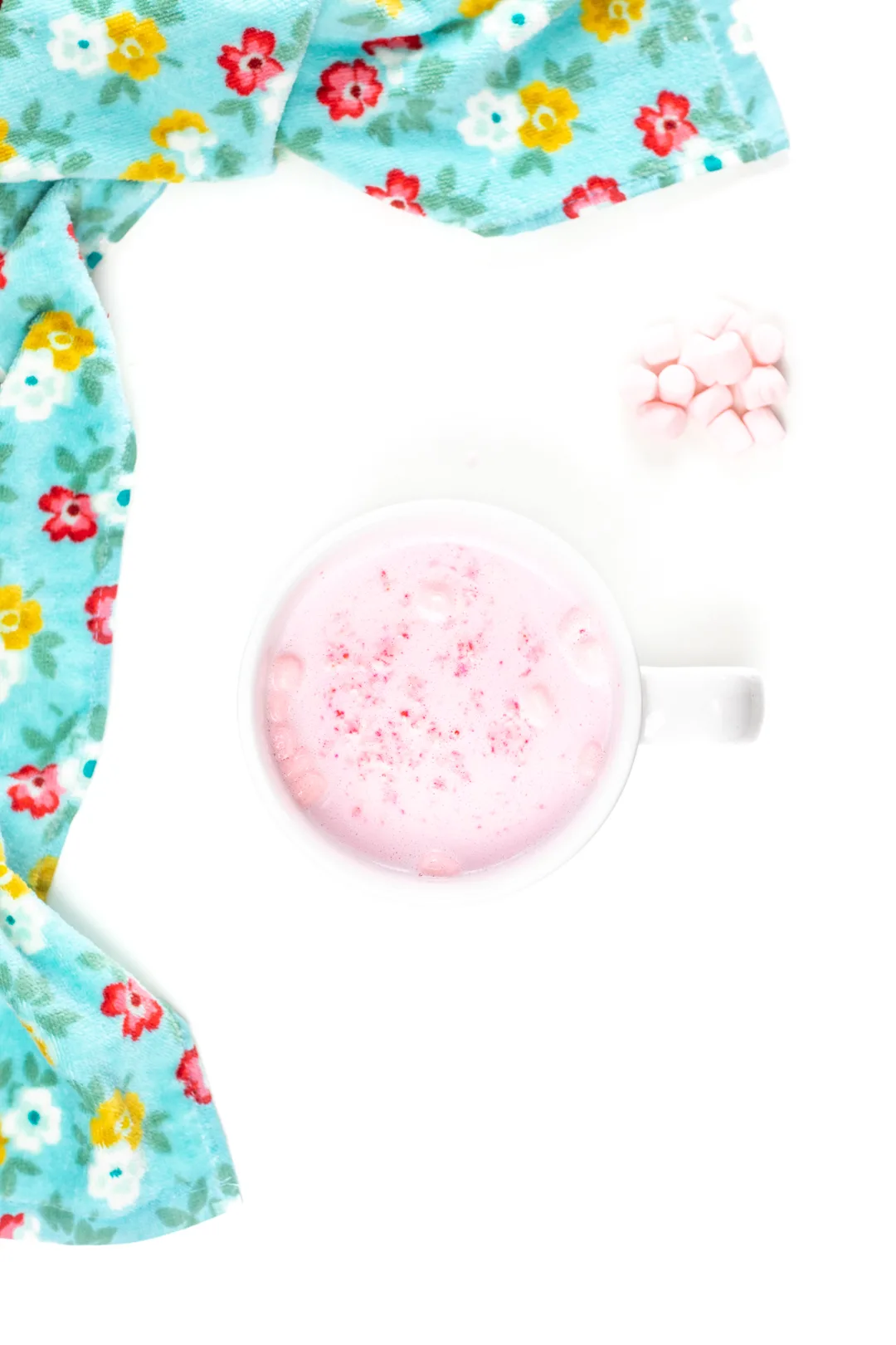 mug of pink hot cocoa with pink marshmallows