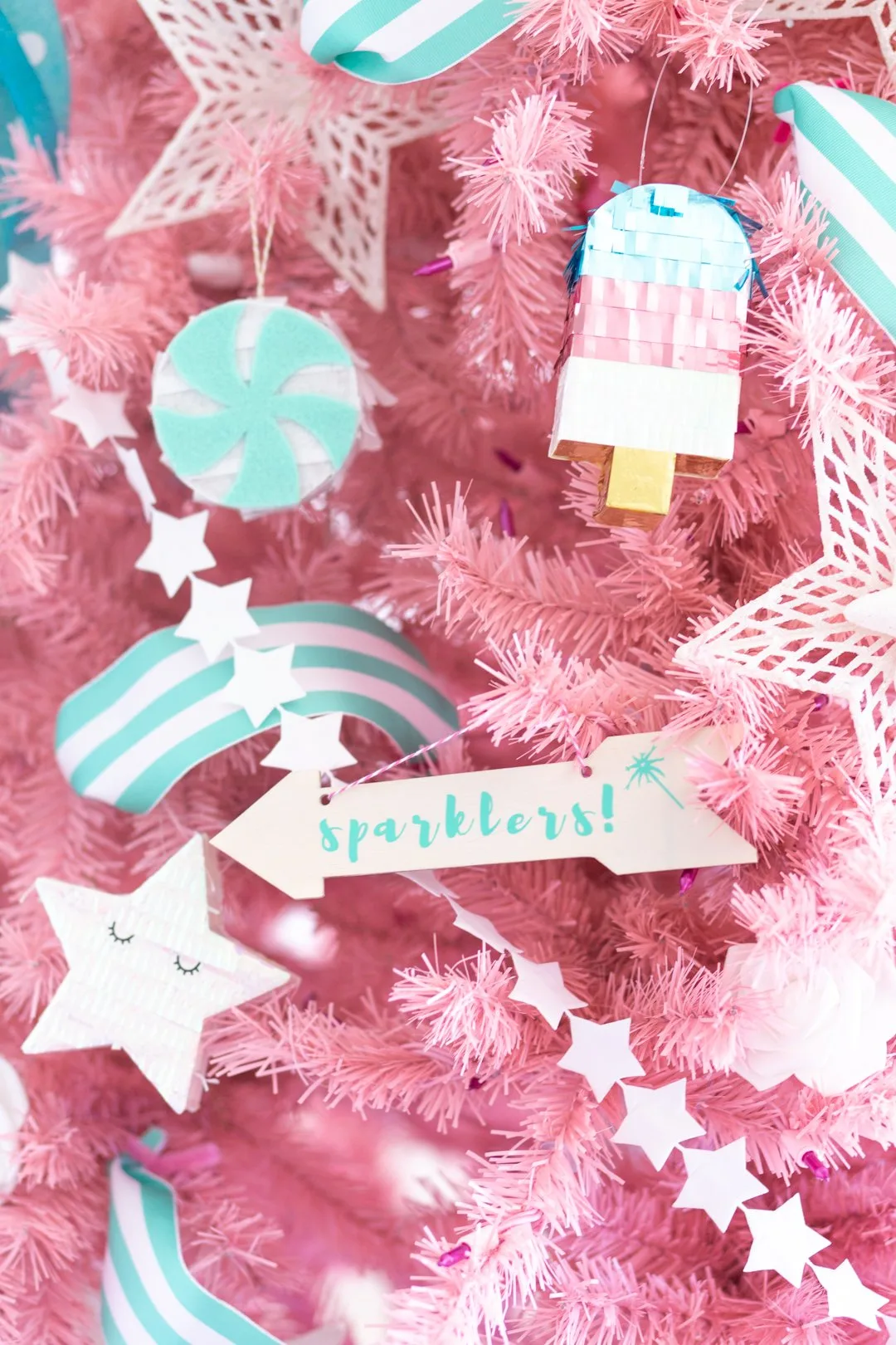 sparklers sign on a pink patriotic summer Christmas tree