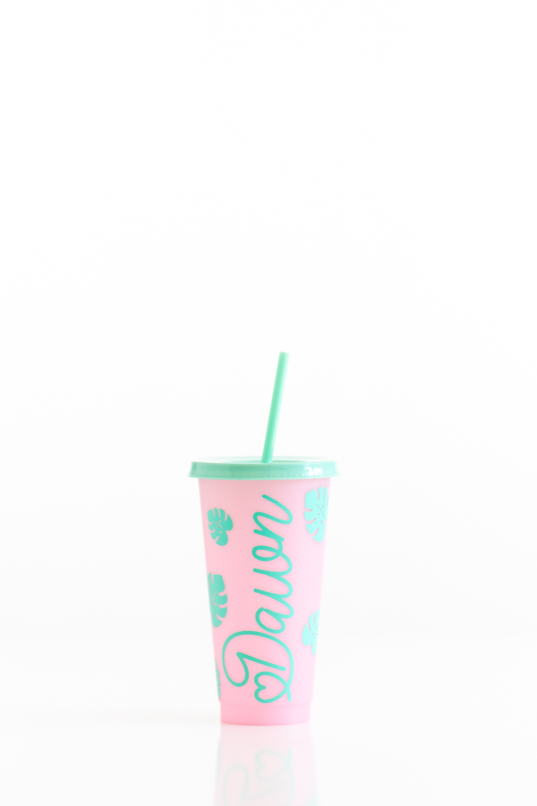 pink color changing tumbler with mint decorations