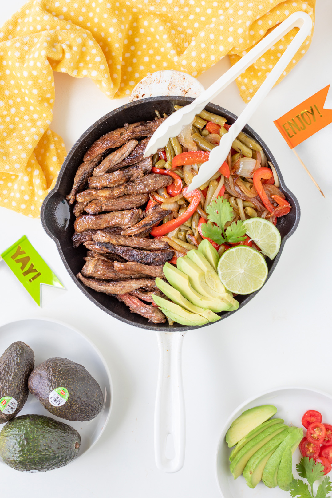 Steak fajitas prepared and ready to be served out of a skillet