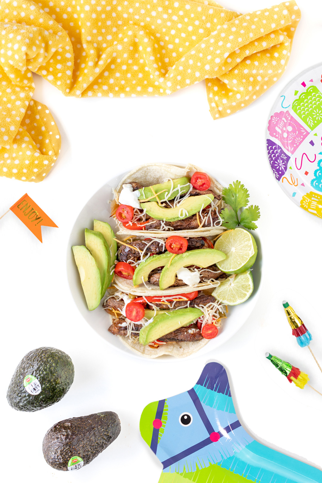 three prepared steak fajitas ready to eat on a plate