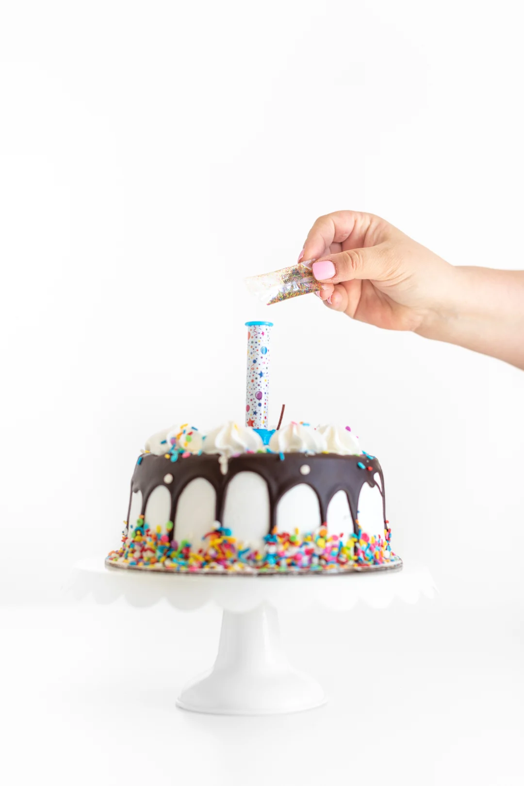 adding edible glitter to a party popper candle