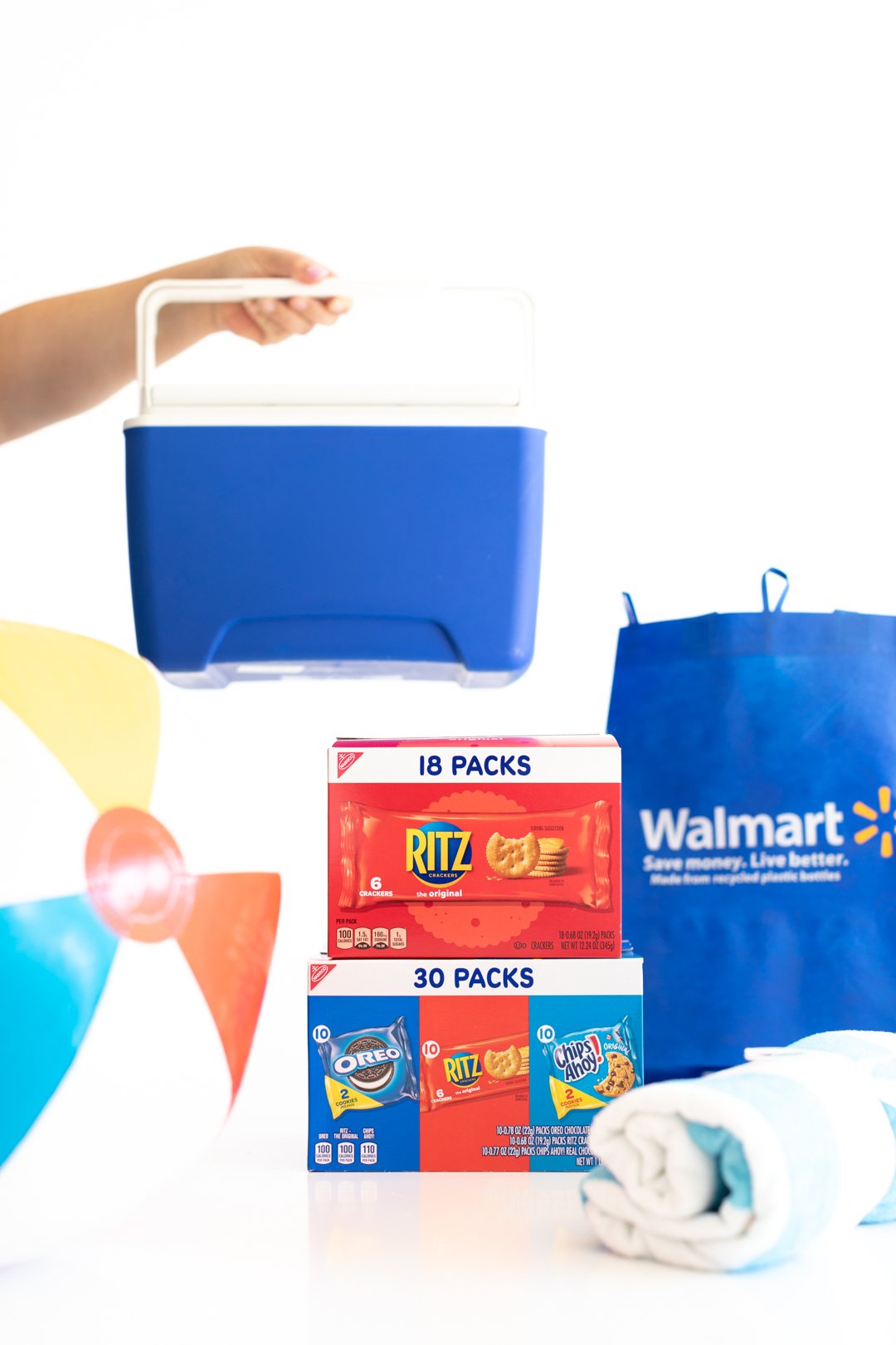 multipacks of nabisco snacks, reusable walmart bag, beach ball and mini cooler