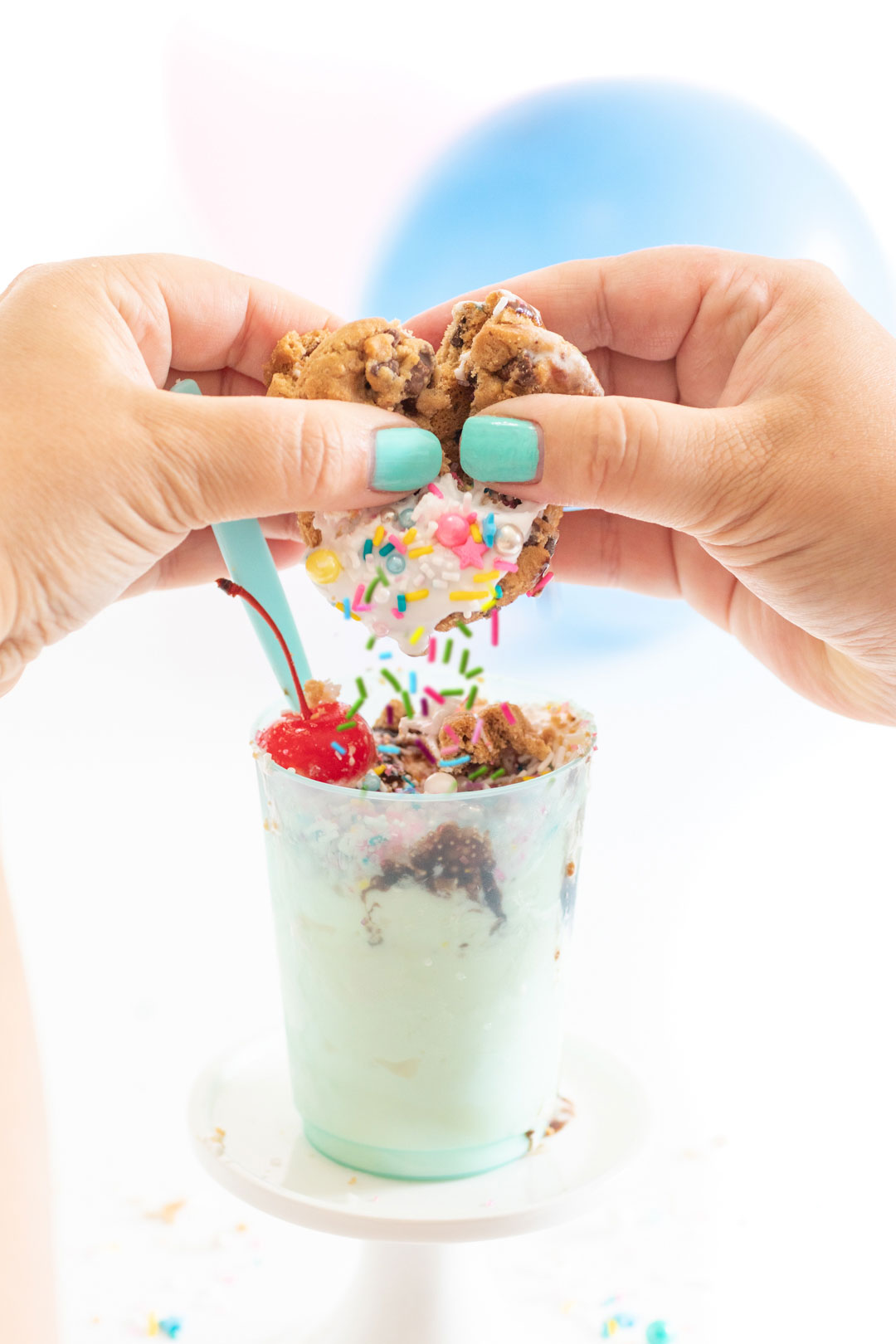 pinata cookie with sprinkles falling out onto a sundae