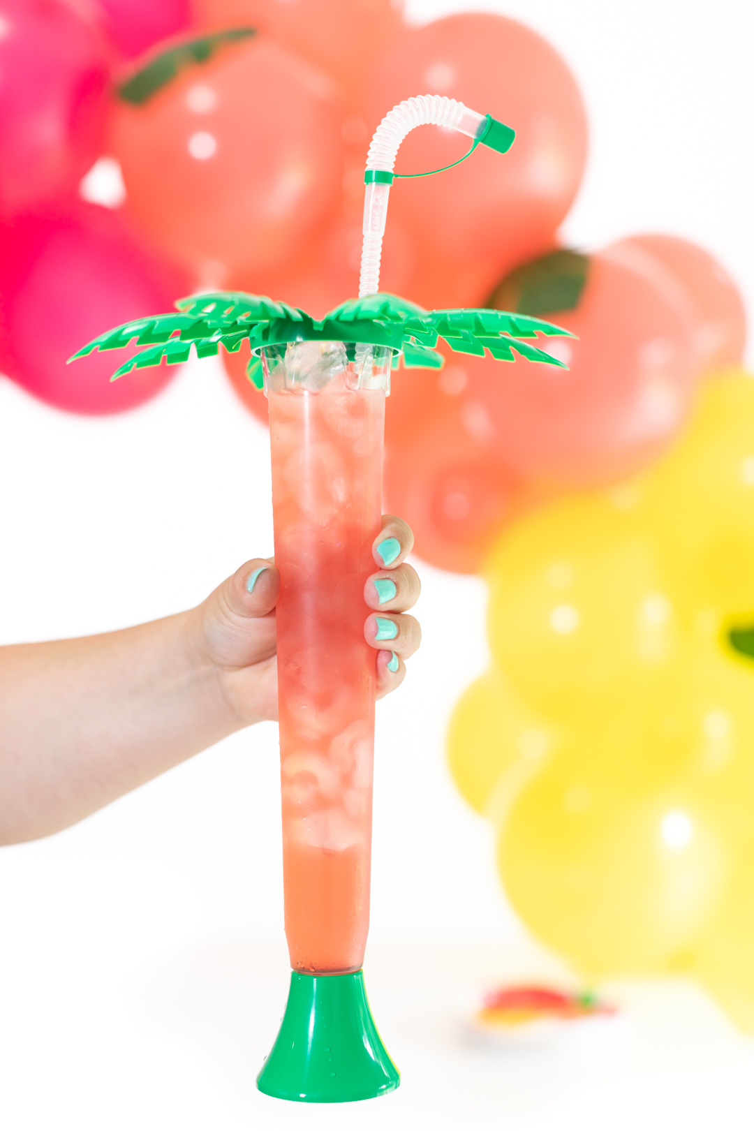 tall skinny palm tree novelty cup filled with caribbean juice