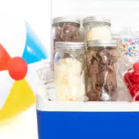 Mason Jars packed with chocolate and vanilla ice cream and loaded into a cooler to take to-go.