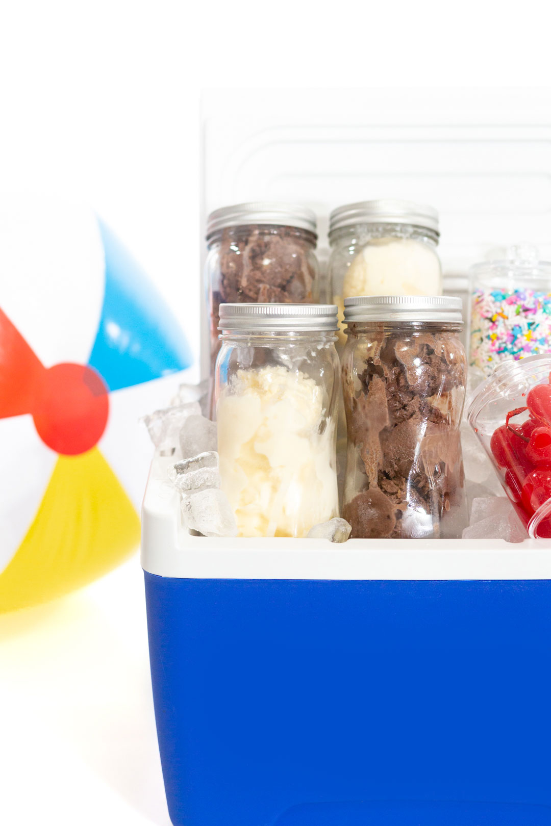 Mason Jars packed with chocolate and vanilla ice cream and loaded into a cooler to take to-go.