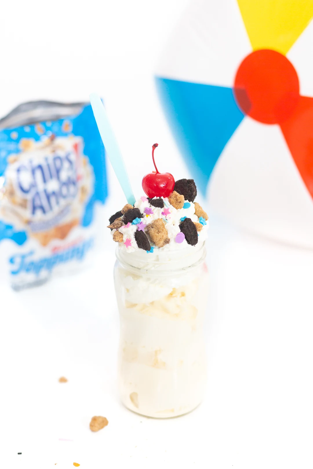 portable ice cream sundaes in mason jars. Vanilla ice cream topped with whipped cream, OREO and Chips Ahoy! Toppings and a Cherry.
