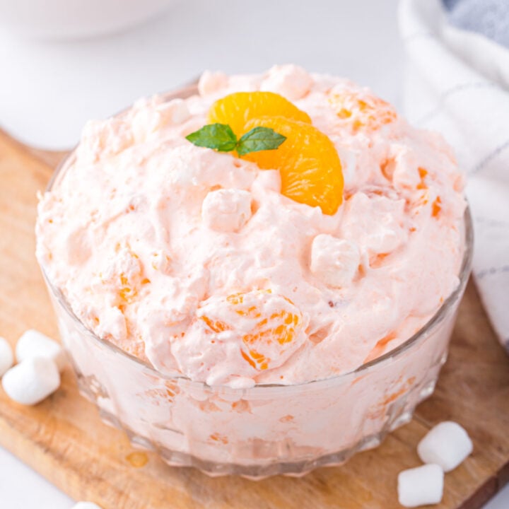 dish of mandarin orange fluff on a wooden cutting board