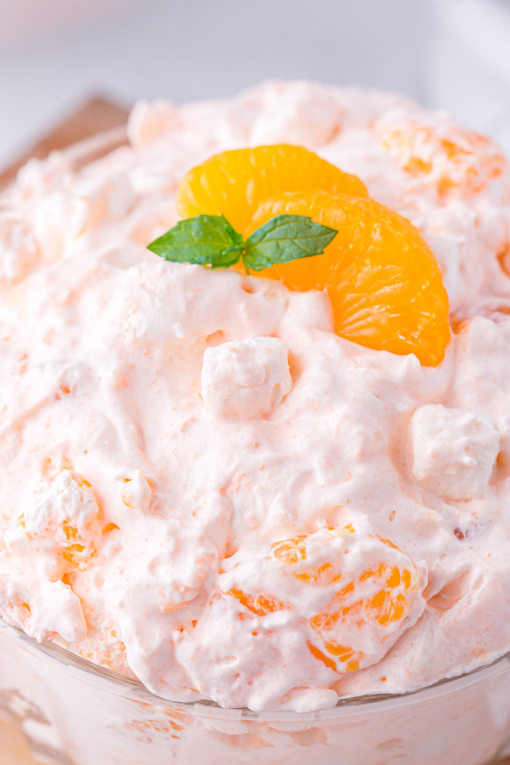 very close up photo of a mandarin orange fluff dessert. 