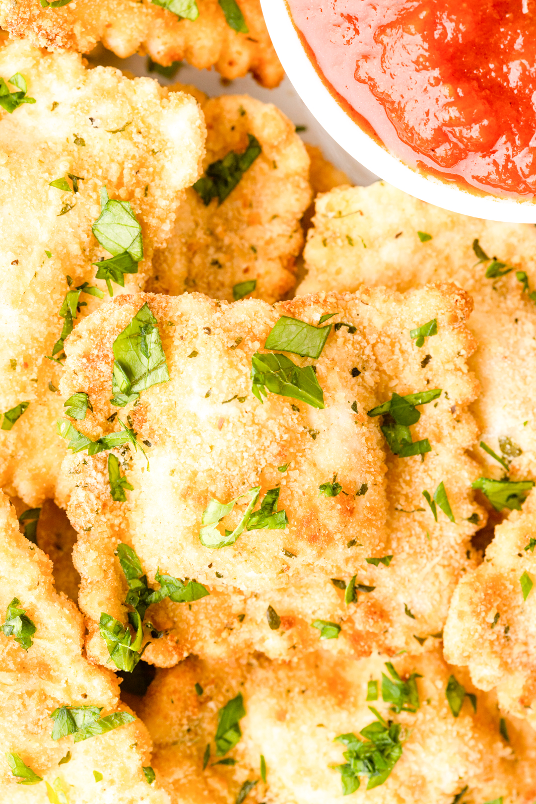 fried ravioli garnished with parsley