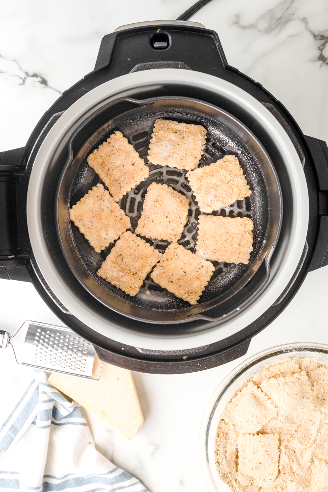 top down, breaded ravioli inside of the air fryer