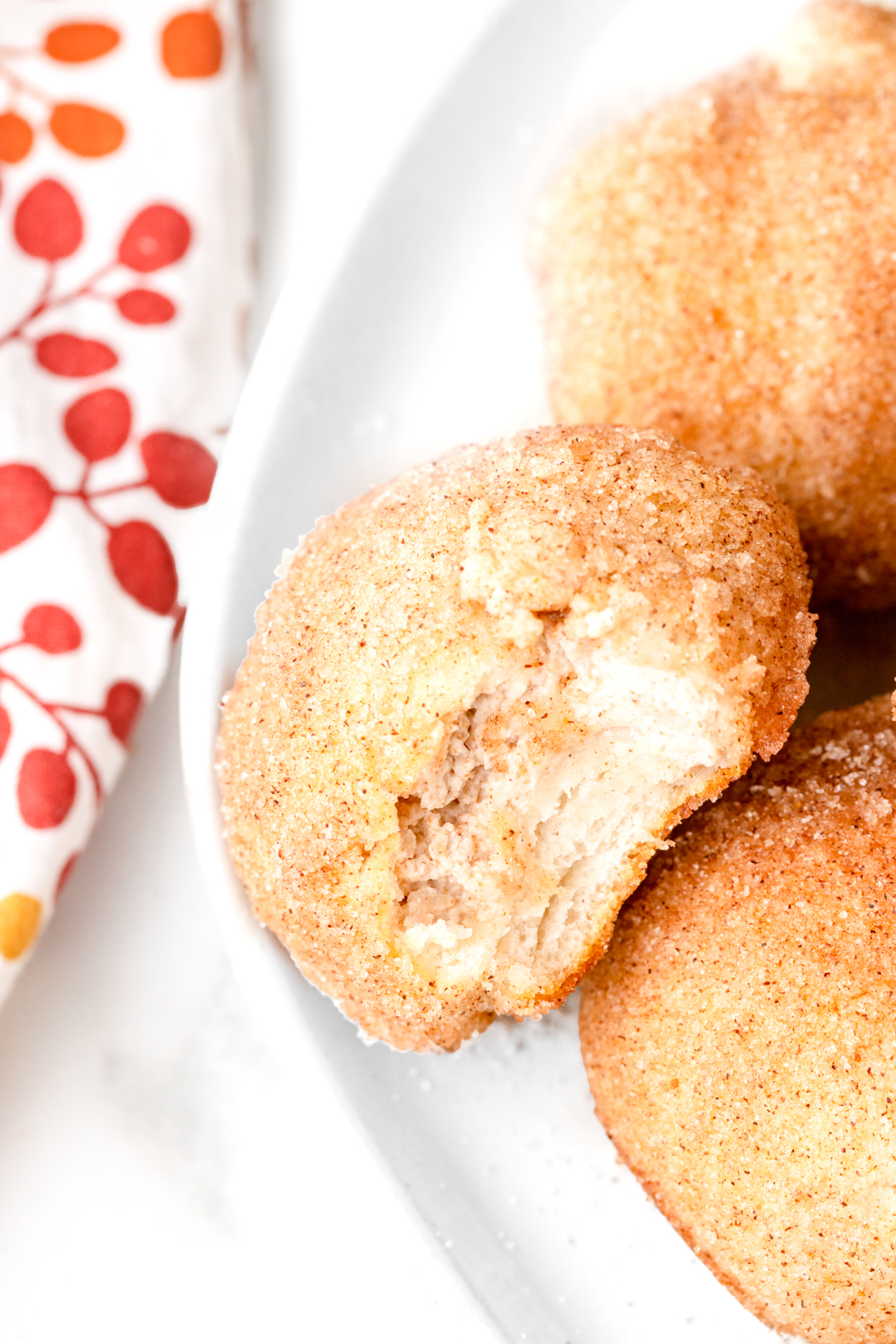 up close bite out of a pumpkin spice donut hole