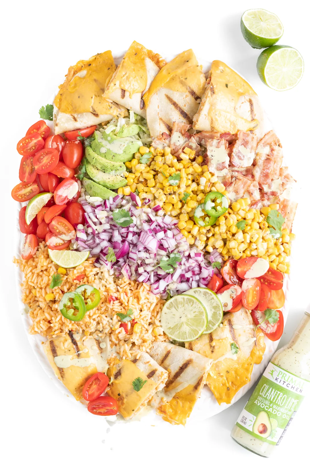 vibrant mexican salad with dressing drizzled all over it.