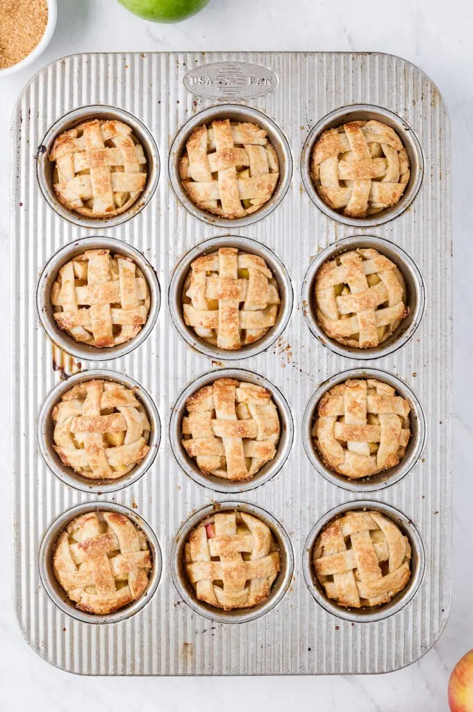 mini apple pies prepared in a muffin tin, overhead photo