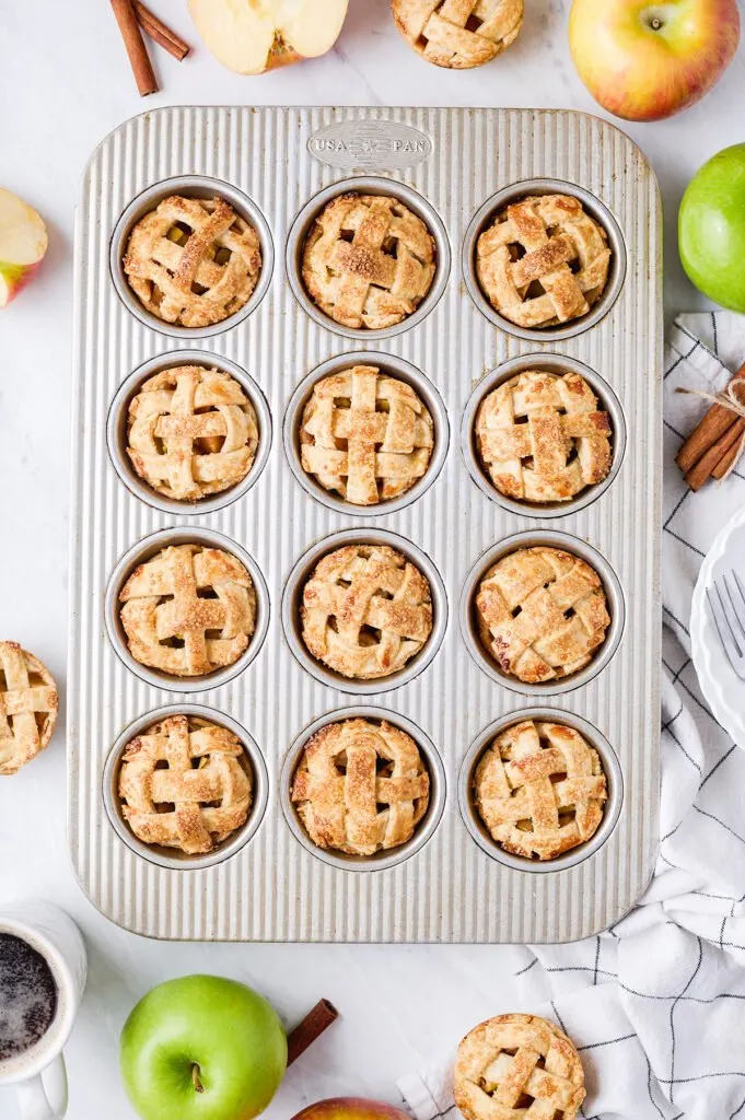 baked apple pie minis in a muffin tin