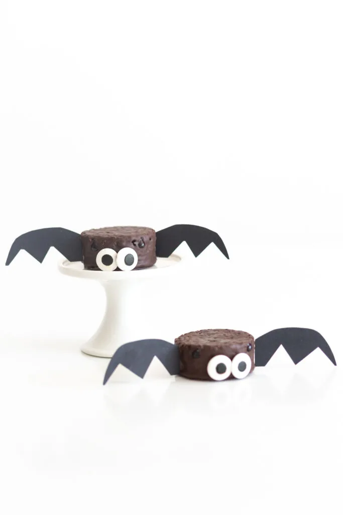 two snack bat dessert cakes decorated like bats