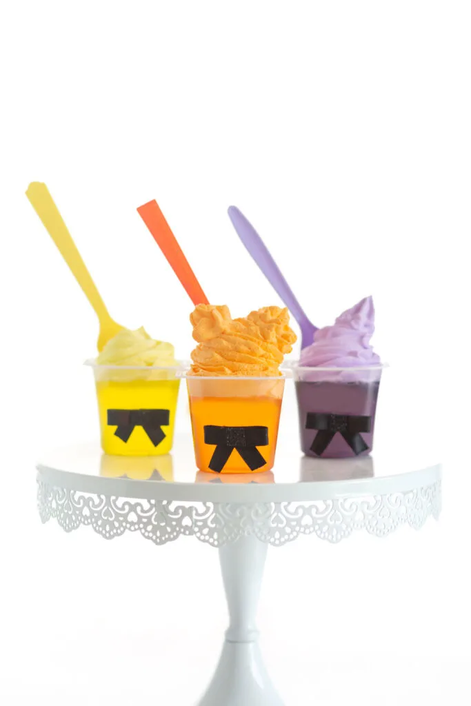 three hocus pocus themed gelatin cups, decorated in likeness of the three hocus pocus witches