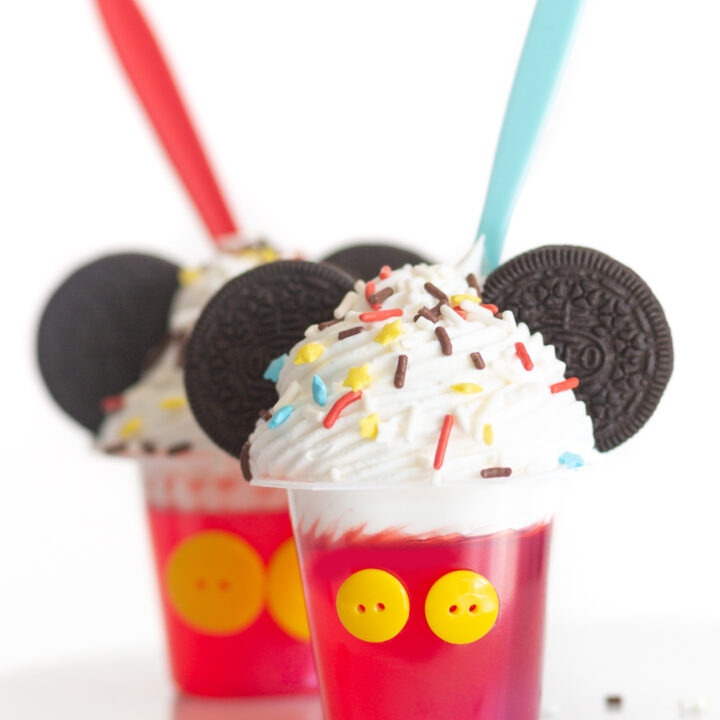 mickey mouse desserts for a part. Gelatin cups topped with whipped cream, sprinkles and OREO cookie ears.