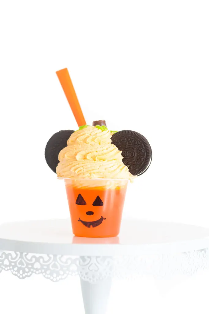 cute halloween mickey mouse inspired treat. Pumpkin colored gelatin treat decorated like a mickey mouse pumpkin