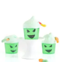 Oogie boogie decorated single jello cups with face drawn on with a black sharpie.