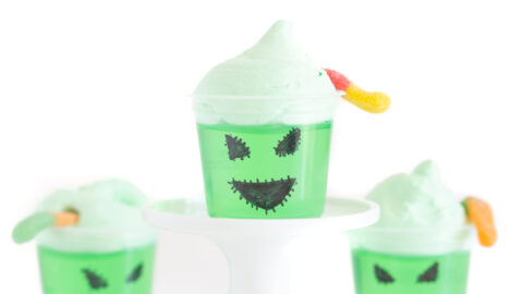 Oogie boogie decorated single jello cups with face drawn on with a black sharpie.