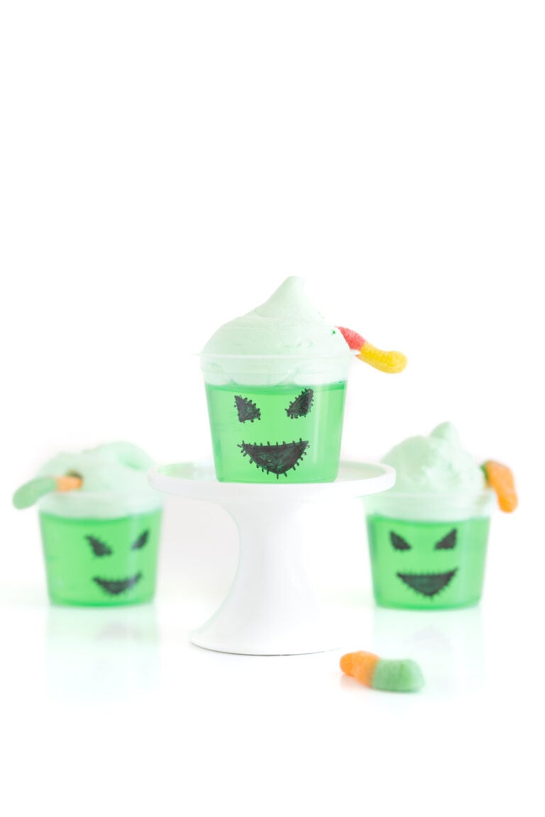 Oogie boogie decorated single jello cups with face drawn on with a black sharpie.