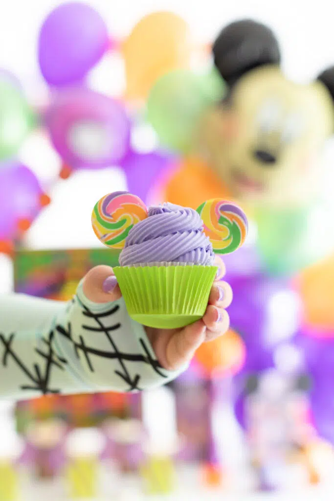 cute mickey mouse halloween cupcake with colorful candy lollipop swirl ears