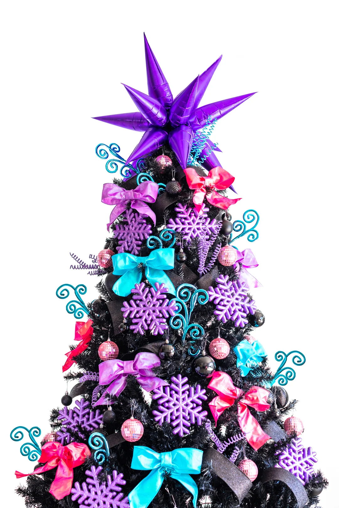 black christmas tree with bold metallic colors. Purple, bright pink and bold blue.