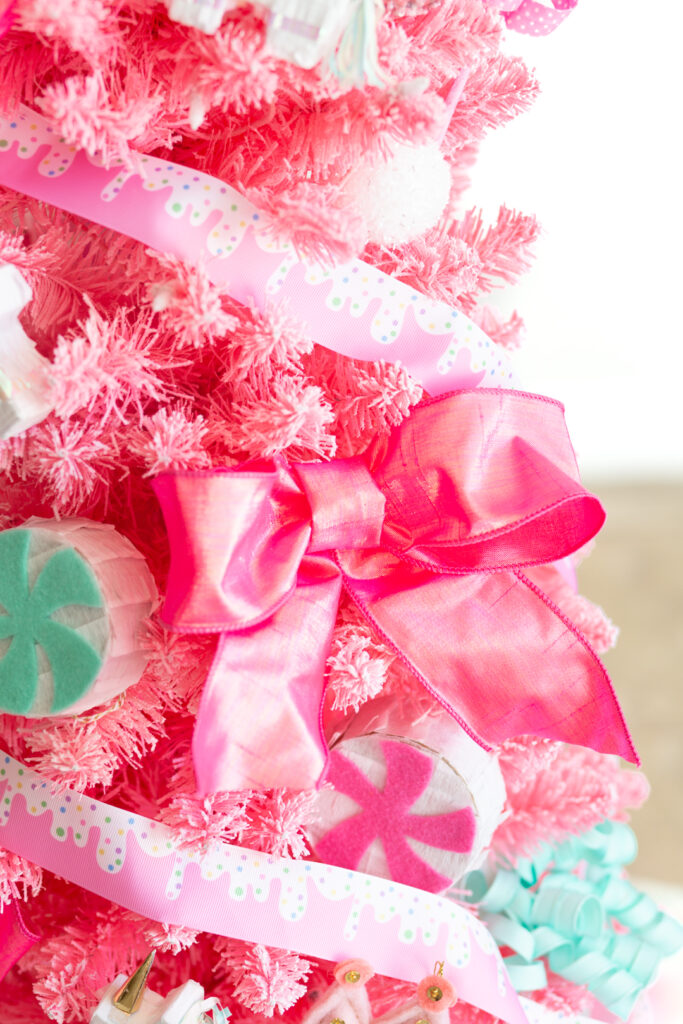 fluffy bright pink metallic ribbon used as a christmas tree decoration on a pink tree