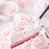 layered peppermint pie cut from the whole pie and being served on a pie spatula