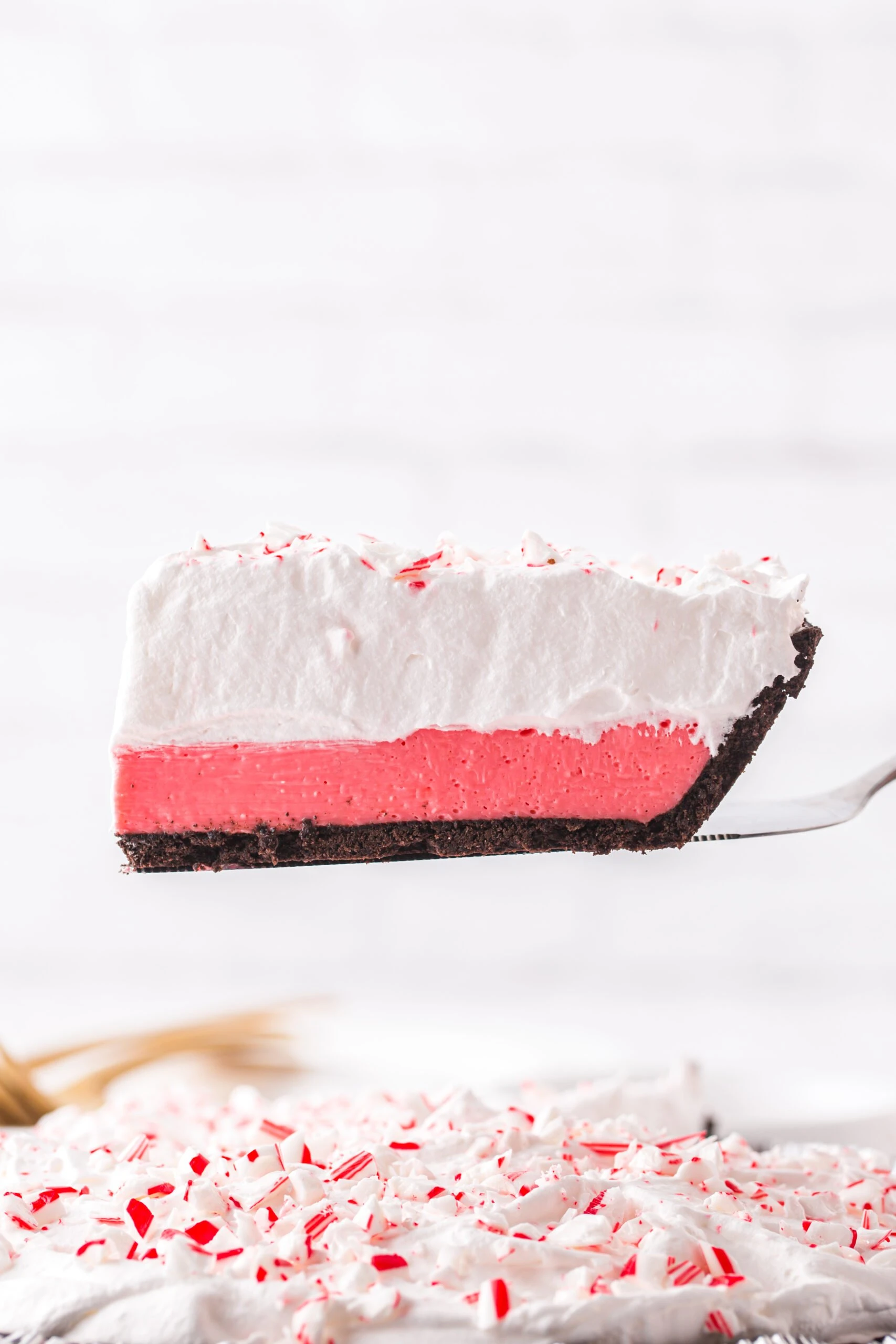 pretty slice of peppermint layered pie being served on a pie spatula
