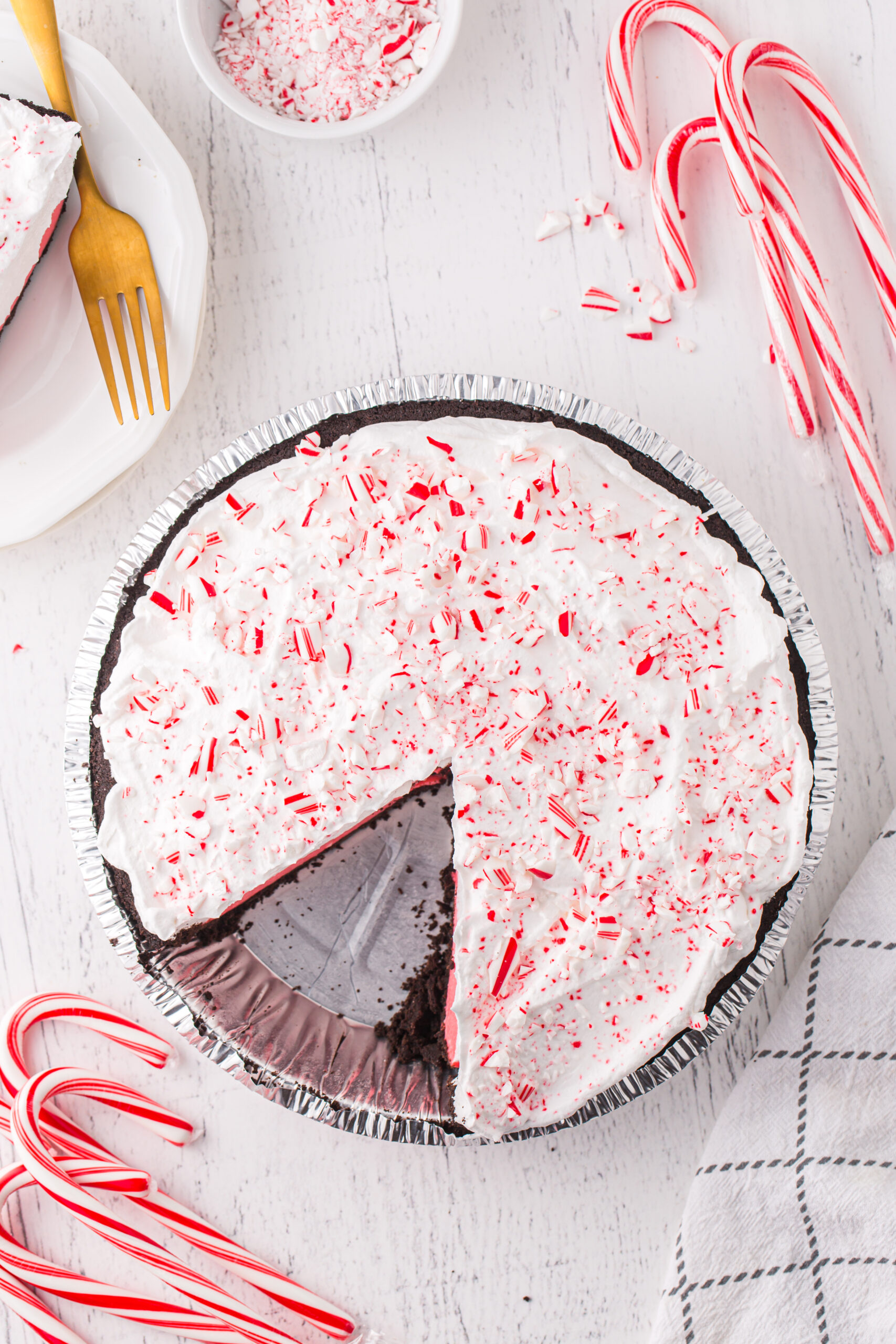 overhead shot of a peppermint pie with a slice taken