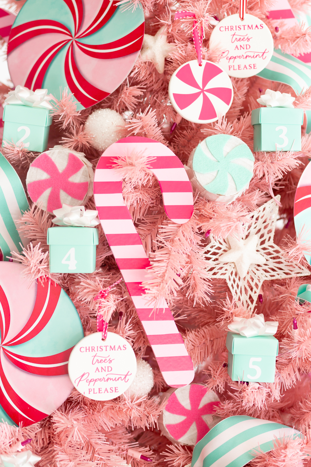 up close of pink wooden candy cane with bright pink stripe stickers made with Cricut