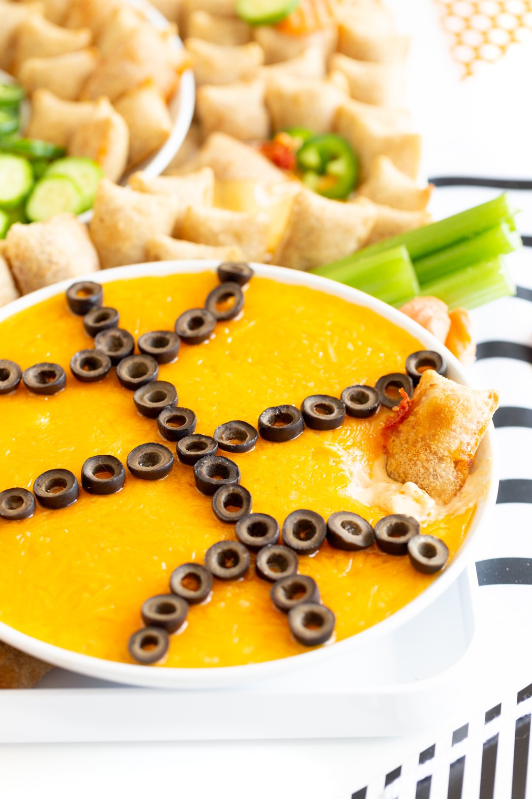 basketball shaped dip in a round bowl for a basketball charcuterie board