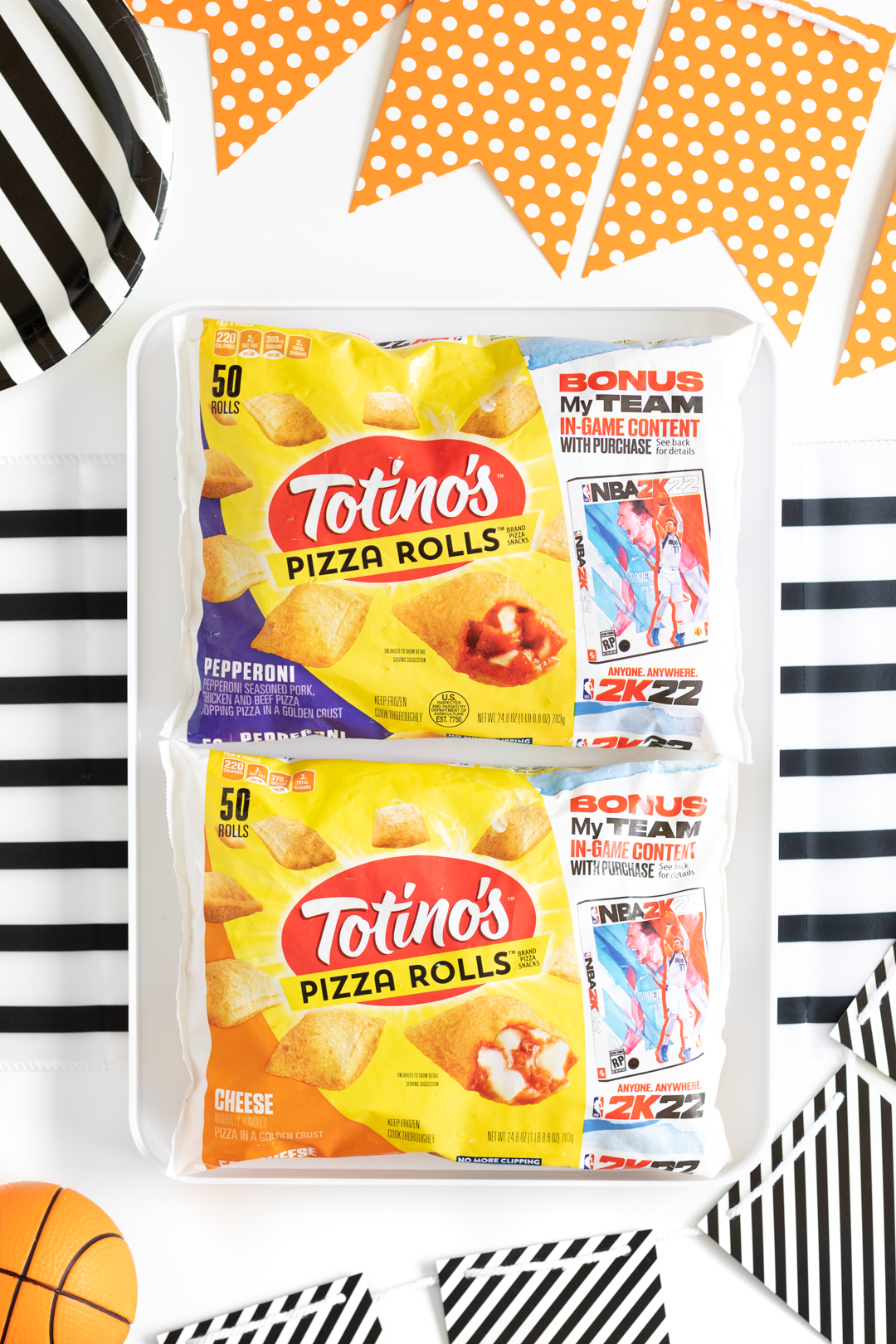 overhead photo of totinos pizza rolls packages on a basketball party table