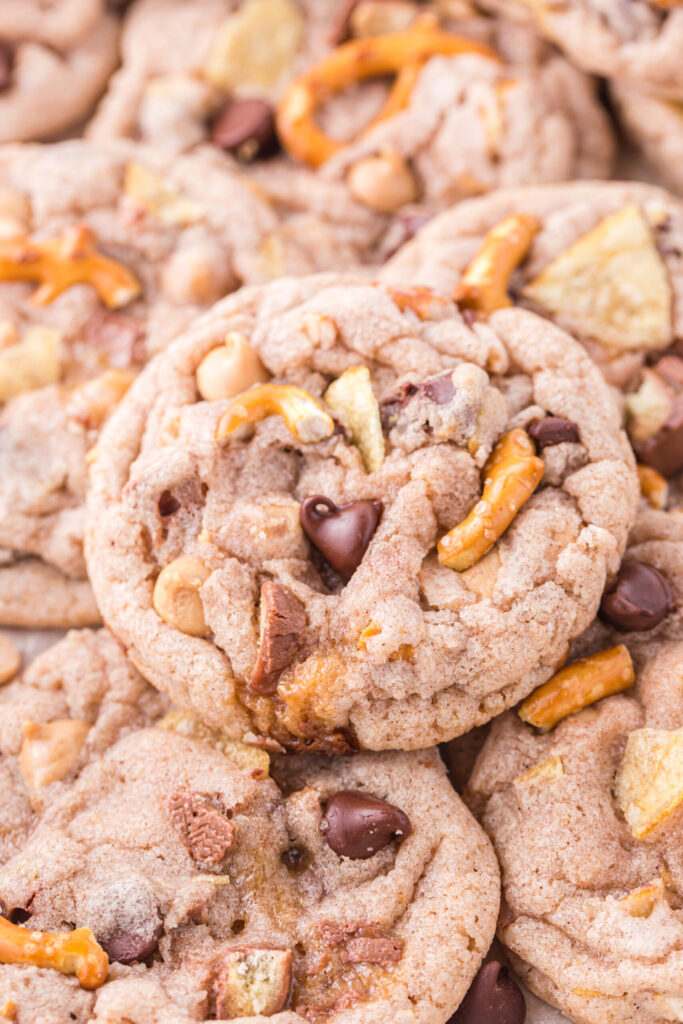 up close view of stacked and layered cookies with pretzel bits and chocolate chips inside them