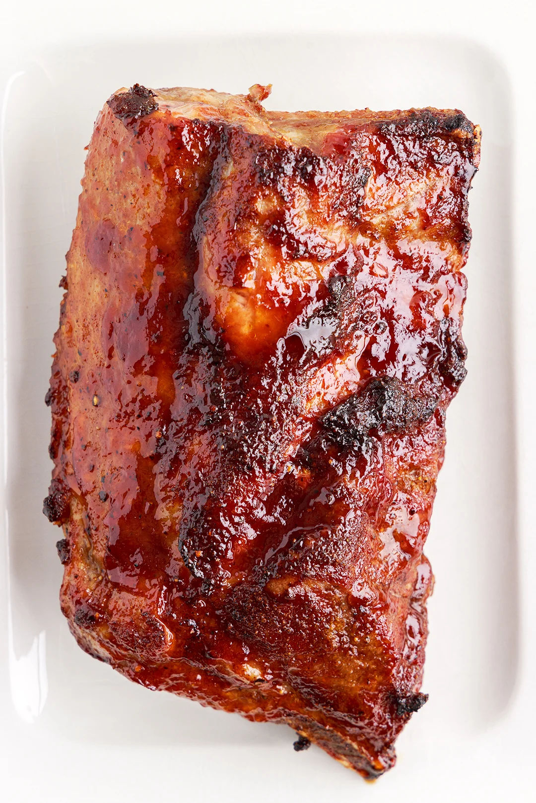 cooked bbq ribs set in an air fryer basket