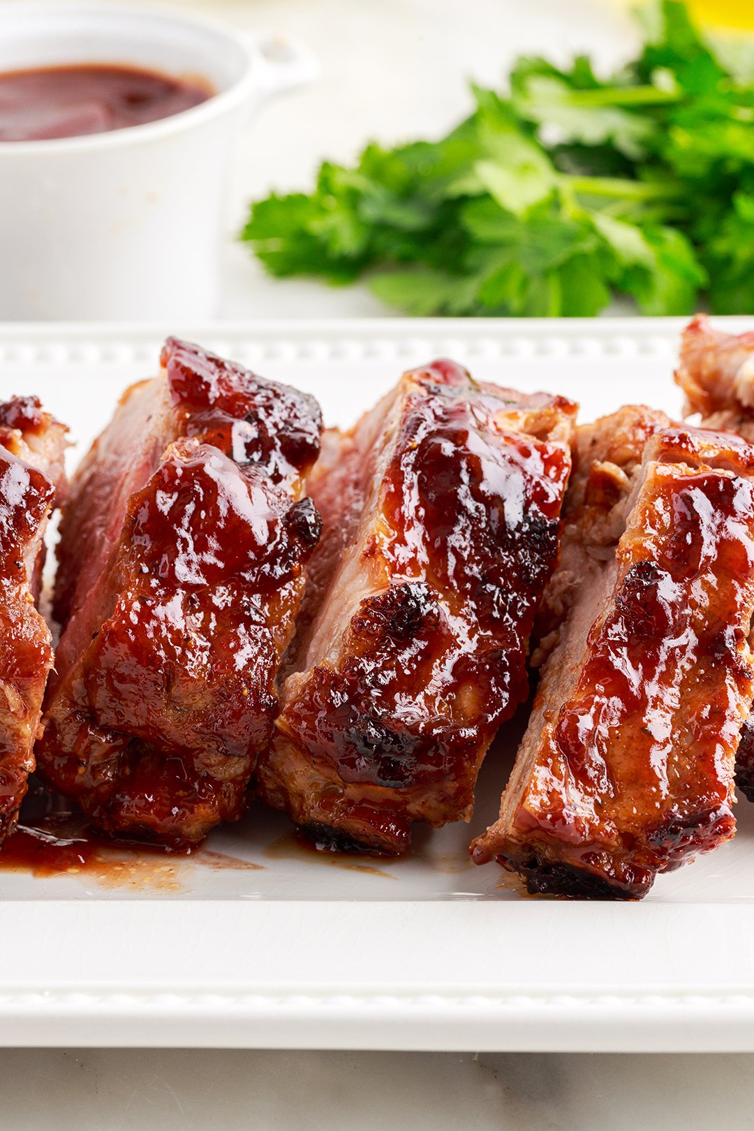plated air fryer ribs with bbq sauce